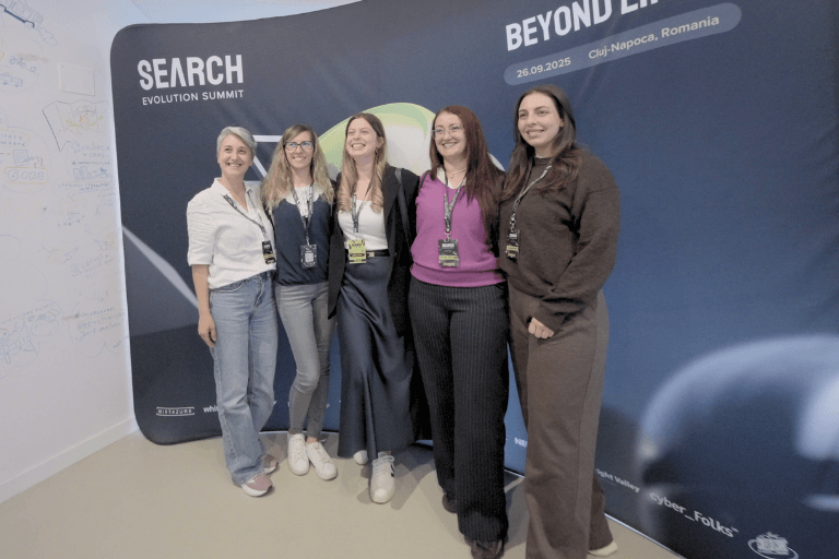 Attendees taking picture with the Search Evolution Summit pop up spider in the background